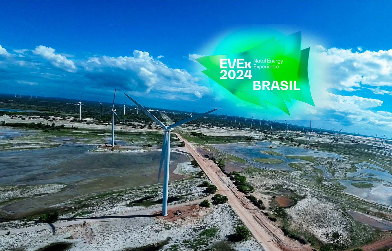 Imagem de eólicas em região litorânea com o logo do EVEx 2024